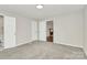 Neutral bedroom featuring a fireplace view, and multiple doorways at 2520 Lower Stone Church Rd, Rockwell, NC 28138