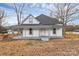 Charming two-story home with a cozy, covered porch and neutral color palette at 2520 Lower Stone Church Rd, Rockwell, NC 28138