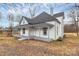 Cozy two-story home with a covered porch and neat landscaping at 2520 Lower Stone Church Rd, Rockwell, NC 28138