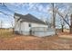 Charming two-story home with a gray deck and mature trees, sitting on a grassy lot at 2520 Lower Stone Church Rd, Rockwell, NC 28138