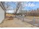 Outdoor patio space with stone fire pit and fenced yard, perfect for entertaining at 2520 Lower Stone Church Rd, Rockwell, NC 28138