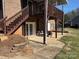 Home features a spacious back patio with stairs leading to a deck at 2521 Whistler Ct, Newton, NC 28658