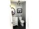 Stylish bathroom with white vanity and dark flooring at 2521 Whistler Ct, Newton, NC 28658