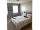 Cozy bedroom with a queen-size bed and striped bedding at 2521 Whistler Ct, Newton, NC 28658