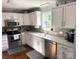 Modern kitchen with white cabinets and stainless steel appliances at 2521 Whistler Ct, Newton, NC 28658