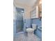 Light blue bathroom with shower, toilet and sink at 3003 River Rd, Shelby, NC 28152