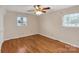 Hardwood floor bedroom with ceiling fan and window at 3003 River Rd, Shelby, NC 28152