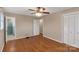 Bedroom with hardwood floors, ceiling fan and access to bathroom at 3003 River Rd, Shelby, NC 28152