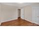 Well-lit bedroom featuring hardwood floors and ample closet space at 3003 River Rd, Shelby, NC 28152