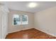 Spacious bedroom with hardwood floors and a double-door closet at 3003 River Rd, Shelby, NC 28152