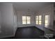 Dining area with chandelier and dark hardwood floors at 3015 Buffet Ln, Monroe, NC 28110