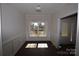 Bright dining room with dark hardwood floors and wainscoting at 3015 Buffet Ln, Monroe, NC 28110