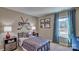 Stylish bedroom with hockey decor and window at 3048 Ora Smith Rd, Lincolnton, NC 28092