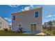 Rear view of house with sliding glass doors and small patio at 3048 Ora Smith Rd, Lincolnton, NC 28092