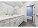 Bathroom featuring double vanity with marble countertop and tiled shower at 3319 Gresham Pl, Charlotte, NC 28211