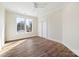 Bright bedroom featuring hardwood floors and a window showcasing the outdoor scenery at 3319 Gresham Pl, Charlotte, NC 28211