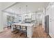 Bright, open kitchen features an island with seating, modern fixtures, and stainless steel appliances at 3319 Gresham Pl, Charlotte, NC 28211