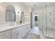 Bright main bathroom features a double vanity, modern fixtures, and a glass-enclosed shower at 3319 Gresham Pl, Charlotte, NC 28211