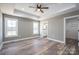 Bright bedroom featuring wood-look floors, and en-suite bathroom access at 343 North Brook Iii School Rd, Vale, NC 28168