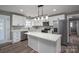 Modern kitchen with white cabinets, quartz countertops, and island at 343 North Brook Iii School Rd, Vale, NC 28168