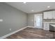 Kitchen with white cabinets, stainless steel appliances, and door to backyard at 343 North Brook Iii School Rd, Vale, NC 28168