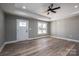 Living room with hardwood floors, recessed lighting, and white door at 343 North Brook Iii School Rd, Vale, NC 28168