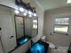 Updated bathroom featuring a blue sink, large mirror, and walk-in shower at 4165 Laurelwood Ct, Concord, NC 28025