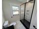 Clean bathroom with a frameless shower and white tile at 4165 Laurelwood Ct, Concord, NC 28025