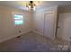 Spacious bedroom with neutral carpeting and lots of natural light at 4165 Laurelwood Ct, Concord, NC 28025