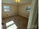 Well-lit bedroom featuring neutral carpeting and two windows at 4165 Laurelwood Ct, Concord, NC 28025