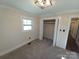 Charming bedroom with neutral carpeting and a large closet at 4165 Laurelwood Ct, Concord, NC 28025