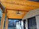 Covered porch ceiling with wood and recessed lighting at 4165 Laurelwood Ct, Concord, NC 28025