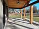 Spacious covered porch with ceiling fan and wood details at 4165 Laurelwood Ct, Concord, NC 28025