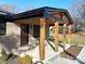 Modern covered porch features wood posts and a wood ceiling at 4165 Laurelwood Ct, Concord, NC 28025