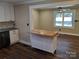 Modern kitchen with white cabinets, butcher block island, and dark hardwood floors at 4165 Laurelwood Ct, Concord, NC 28025