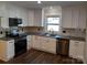 Modern kitchen with white cabinets and granite countertops at 4165 Laurelwood Ct, Concord, NC 28025