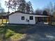 White side of house with covered carport and porch at 4165 Laurelwood Ct, Concord, NC 28025