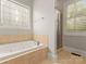 Bathroom with soaking tub, shower and stained glass window at 498 New Salem Rd, Statesville, NC 28625