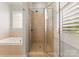 Bathroom with shower, soaking tub and plantation shutters at 498 New Salem Rd, Statesville, NC 28625