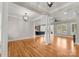 Open dining room with hardwood floors and view into kitchen at 498 New Salem Rd, Statesville, NC 28625