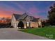 Brick home with 3-car garage, at dusk at 498 New Salem Rd, Statesville, NC 28625