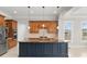 Large kitchen island with granite countertop and dark blue cabinets at 498 New Salem Rd, Statesville, NC 28625