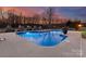 Relaxing in-ground pool at dusk at 498 New Salem Rd, Statesville, NC 28625