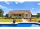 Inviting pool area with a brick home and lush landscaping at 498 New Salem Rd, Statesville, NC 28625