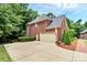 Two-car attached garage with a brick exterior at 508 Cobbs Glen Ct, Rock Hill, SC 29732