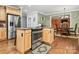 Kitchen island with cooktop, oven, and granite countertops at 508 Cobbs Glen Ct, Rock Hill, SC 29732