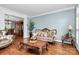 Elegant living room featuring hardwood floors, ornate furniture, and a view into the dining area at 508 Cobbs Glen Ct, Rock Hill, SC 29732