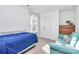 Bedroom with twin bed and teal couch at 5510 Brickstone Dr, Charlotte, NC 28227