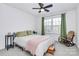 Bright bedroom with a queen bed and rocking chair at 5510 Brickstone Dr, Charlotte, NC 28227