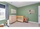 Bedroom with crib, dresser, and changing table at 5510 Brickstone Dr, Charlotte, NC 28227